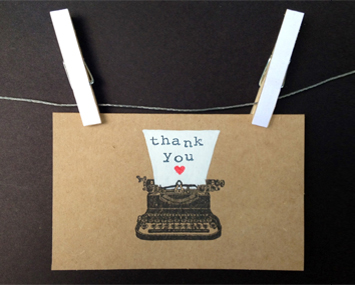card saying thank you hanging on a line with pegs